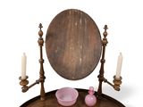 a wooden table with a mirror and a bowl on it