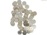 a pile of silver coins on a white background