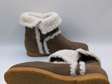 brown knitted slippers with white fur linings on a white background