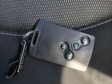 a black suitcase with a metal buckle on it ' s side