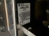 a close up of a metal box with a label on it