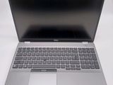 an open laptop computer sitting on top of a white table