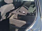 a car with the door open and the seat up