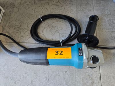 an image of a corded sander on the floor
