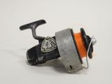 a reel with a spool on it on a white surface