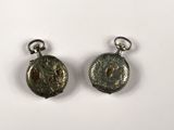 pair of silver earrings with a coin on each side