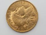 an image of a gold coin with a picture of a woman on it