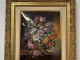 une image d'un tableau de fleurs dans un vase sur une table