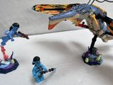 a small toy figure of a dragon and a small figure of a man