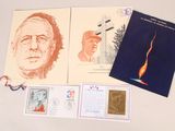 a collection of stamps and postcards on a table