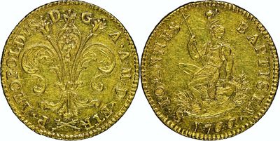 a gold coin with an image of a woman on it