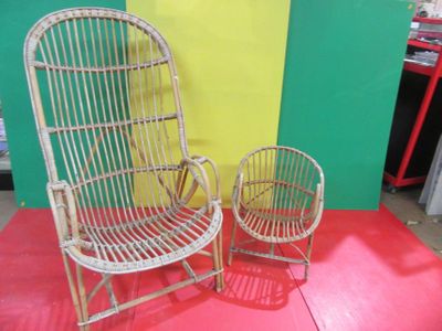 pair of wicker chairs in a room with a yellow and green wall