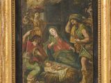 une peinture à l'huile représentant une crèche, dans un cadre doré