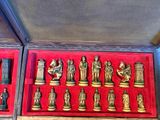 a box with a bunch of chess pieces in it