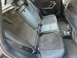 the back seats of a car are empty in the back of the car