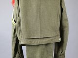 a green jacket and pants on a mannequin mannequin mannequin mannequin mannequin mannequin mannequin mannequin mann