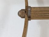 a bow that is attached to a stand on a table