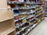 many shelves in the store that have various items on them
