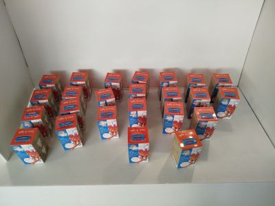 many boxes of food sitting on a shelf in a room