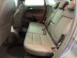 the back seat of a car with a remote control in it
