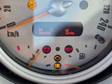 a close up of a speedometer on a car ' s dashboard
