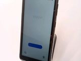 a cell phone that is sitting on top of a stand