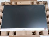 a computer monitor in a cardboard box on a table