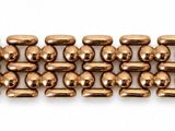 a close up of a row of brass beads on a white background