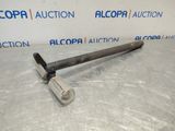 a picture of a metal hammer on a table with a sign in the background