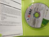 a cd in a green case on a table
