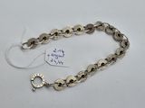 a close up of a bracelet with a tag on it