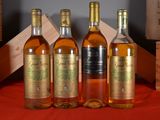 three bottles of wine sitting next to each other on a table