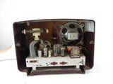 an old fashioned television with a lot of electronics inside of it