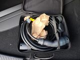 a bag of wires in the back seat of a car