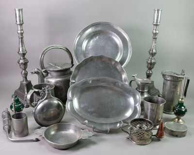 a lot of silver items that are sitting on a table