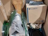 a cardboard box full of items that are in the middle of a pile