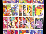 a lot of pokemon cards on a black background