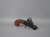 an old gun with a wooden handle on a white background