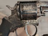a gun that is on display in a glass case