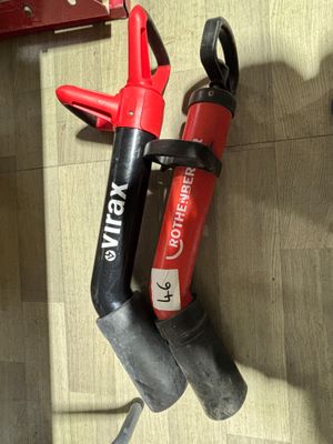 a picture of a red and black blow dryer and a red and black blow dryer