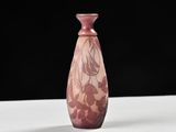 purple glass vase on a white table with a black background
