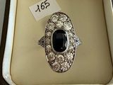 an image of a ring in a box with a price tag on it