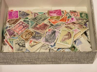 a box full of postage stamps sitting on a table