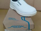 a white shoe that is sitting on top of a box