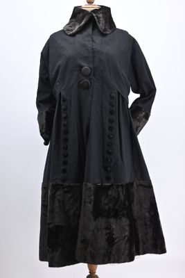 a woman ' s black coat on a mannequin mannequin mannequin mannequin mannequin mannequin mannequin mannequin