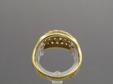 a close up of a gold ring with diamonds on top of it