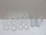 many empty wine glasses and a bottle on the table