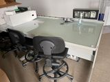 a desk with a chair and a computer on it