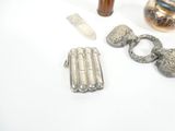 a silver object on the table next to other items