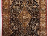 un ancien tapis persan à motif de médaillon
